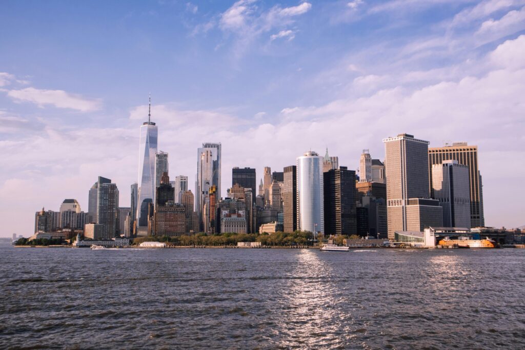 Scenic view of Manhattan skyline and Hudson River with clear sky.