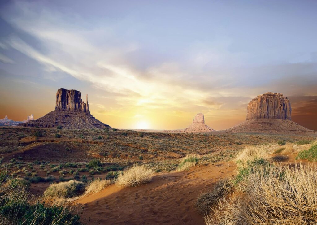 pexels-photo-414136-414136 Breathtaking view of Monument Valley's iconic rock formations at sunset, showcasing vivid desert landscape.